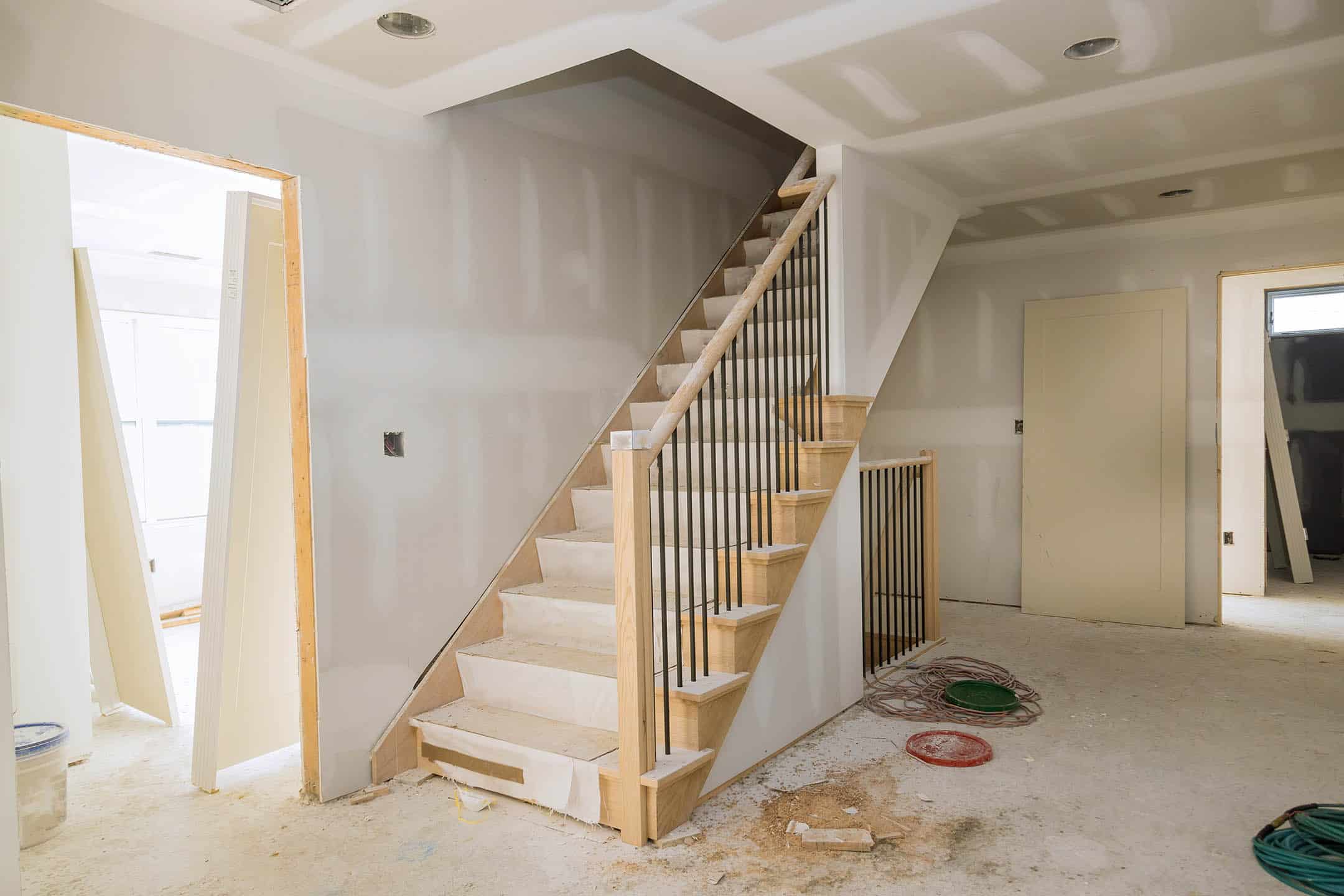 New home installing material for repairs under construction apartment